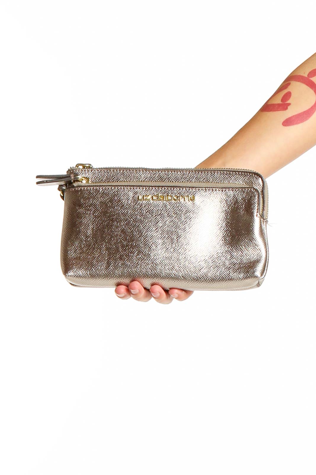 Front view of Liz Claiborne gold metallic zip-top clutch held in hand