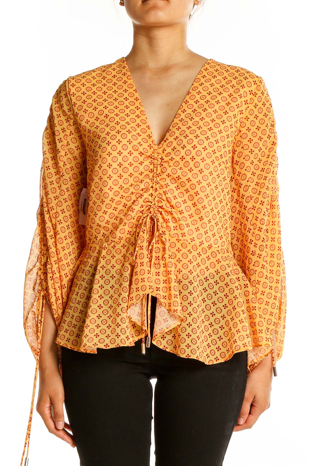 Front view of SilkRoll yellow geometric print peplum blouse with V-neck and balloon sleeves