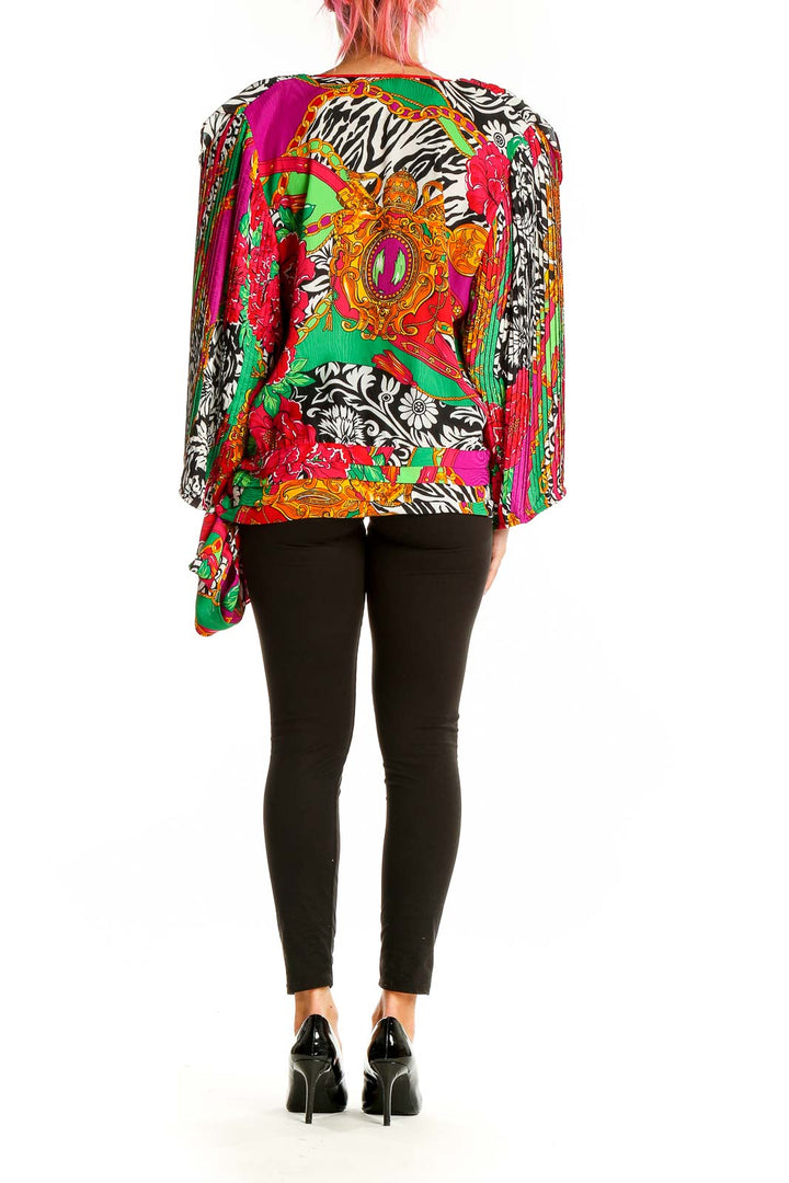 Back view of multicolor floral print Diane Freis wrap blouse showing full pattern