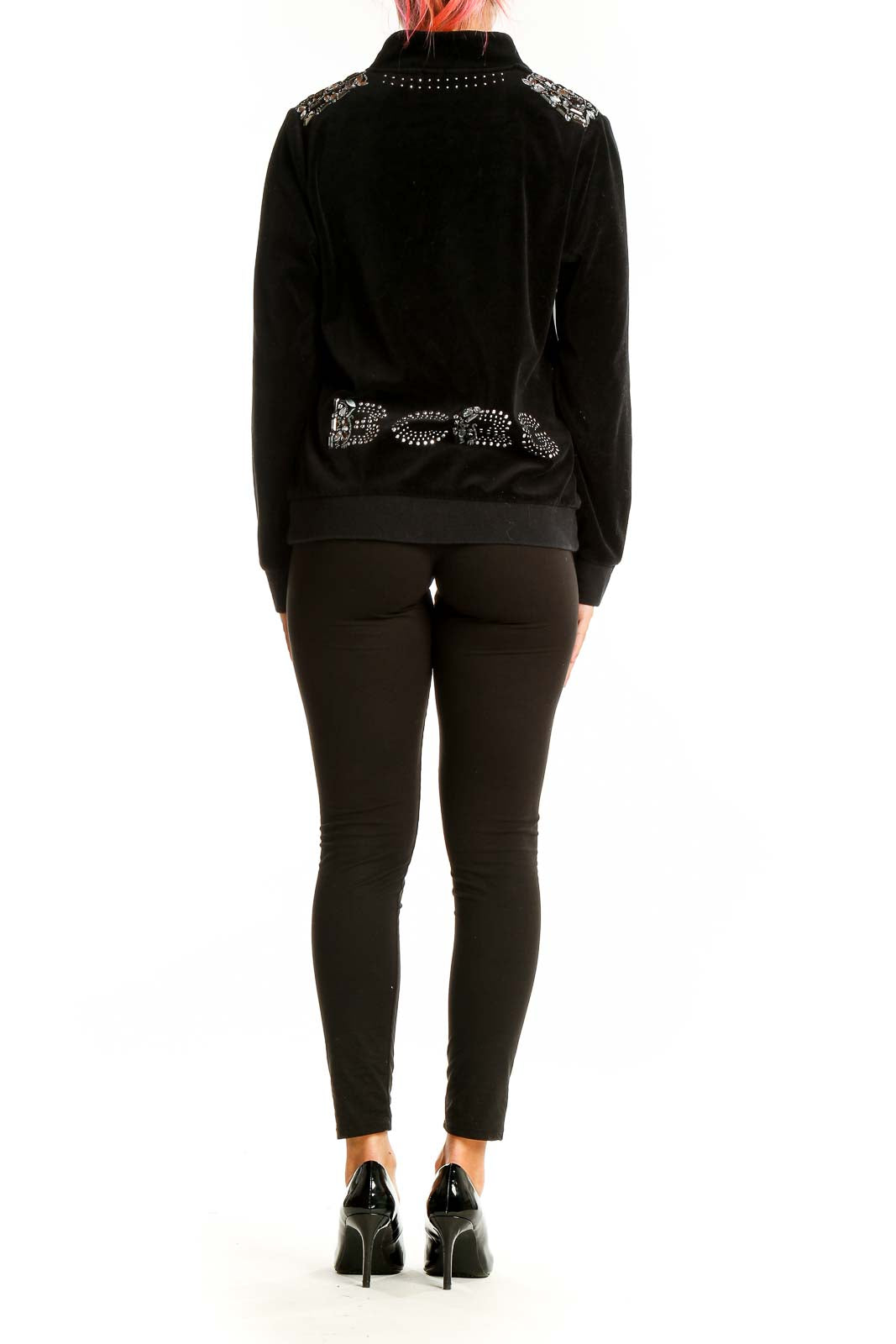 Back view of BCBGeneration black velvet bomber jacket showing studded design