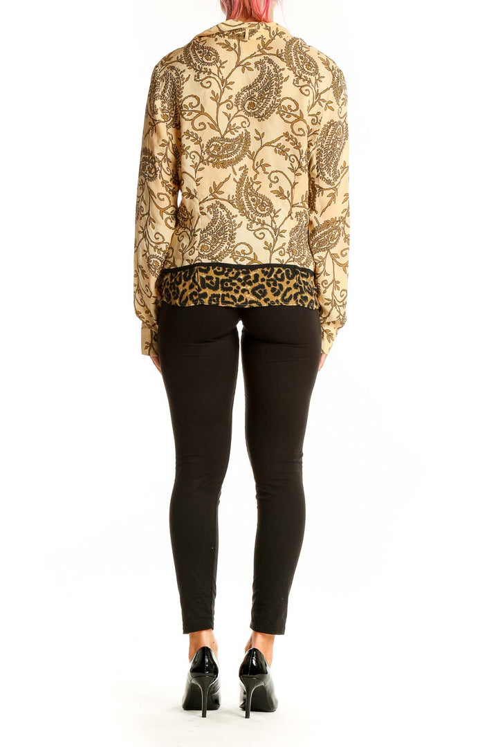 Back view of Victoria SOIE beige silk blouse showing paisley print and leopard trim