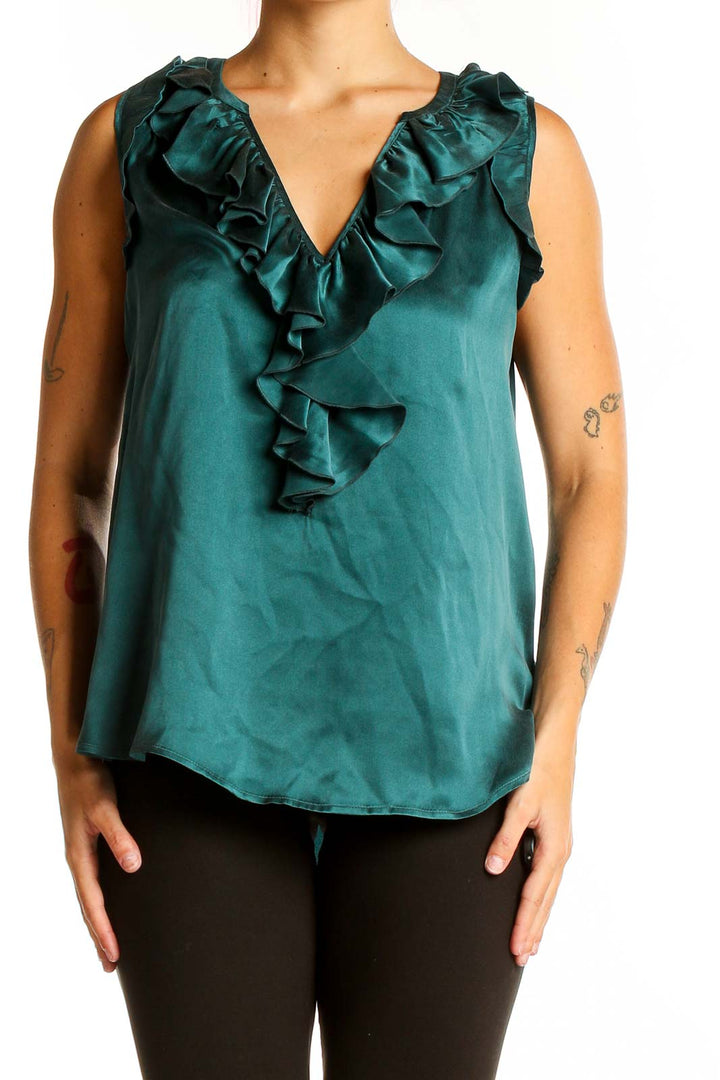 Front view of emerald green silk blouse with ruffled V-neckline