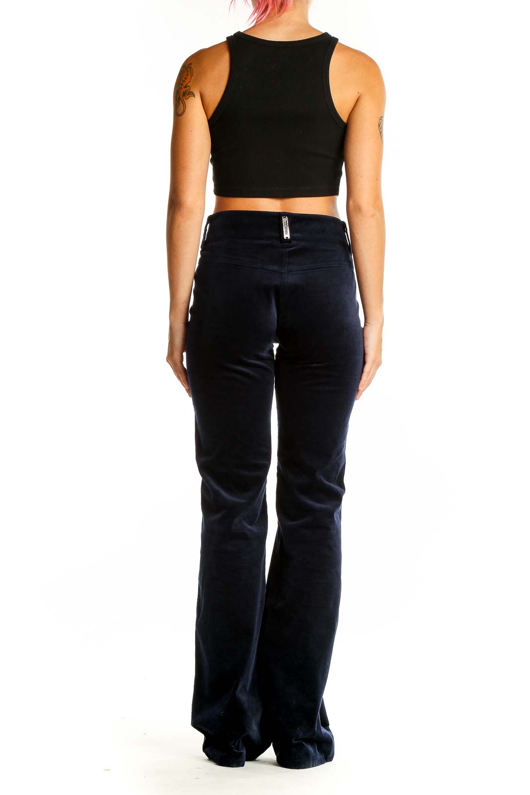 Back view of Roccobarocco navy velvet wide-leg trousers on model