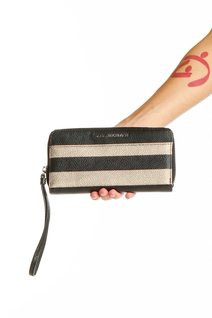 Front view of Dana Buchman black and gold striped zip-around wallet