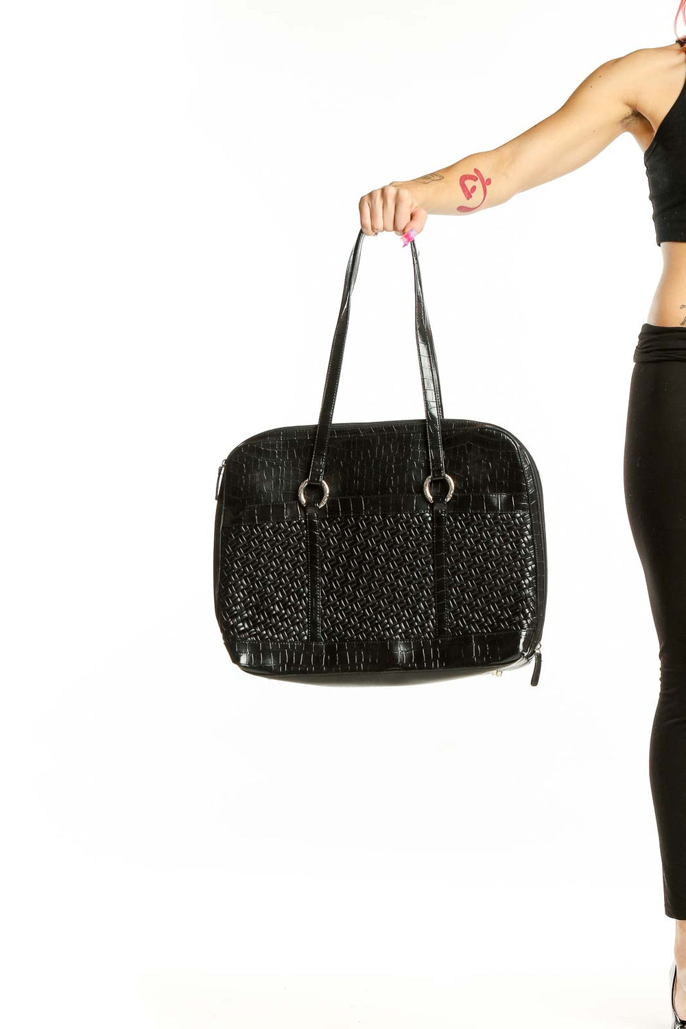 Front view of black woven leather shoulder bag by Coldwater Creek