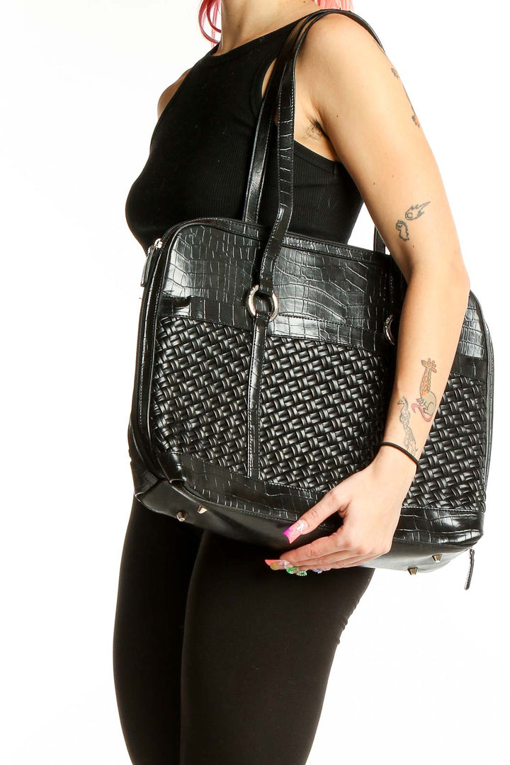 Front view of black woven leather shoulder bag by Coldwater Creek