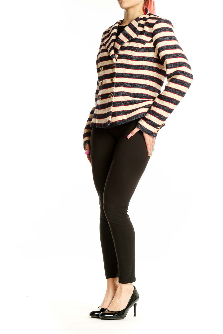 Front view of Cabi cream and navy striped double-breasted jacket