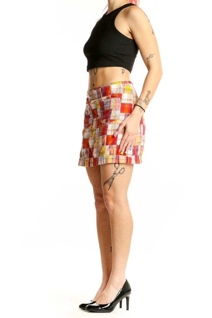 Front view of J.Crew multicolor patchwork mini skirt with front pockets