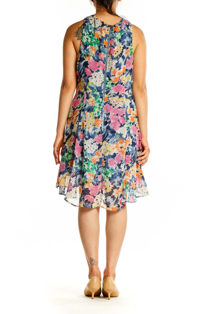 Back view of Pink Owl multicolor floral sleeveless chiffon dress showing high-low hem