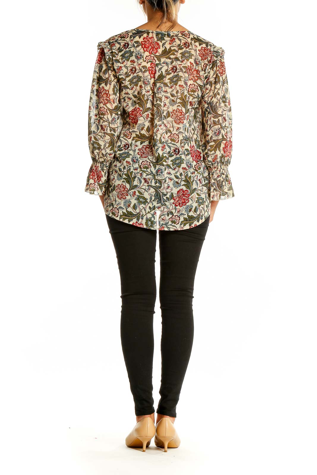 Back view of beige floral print blouse showing all-over pattern