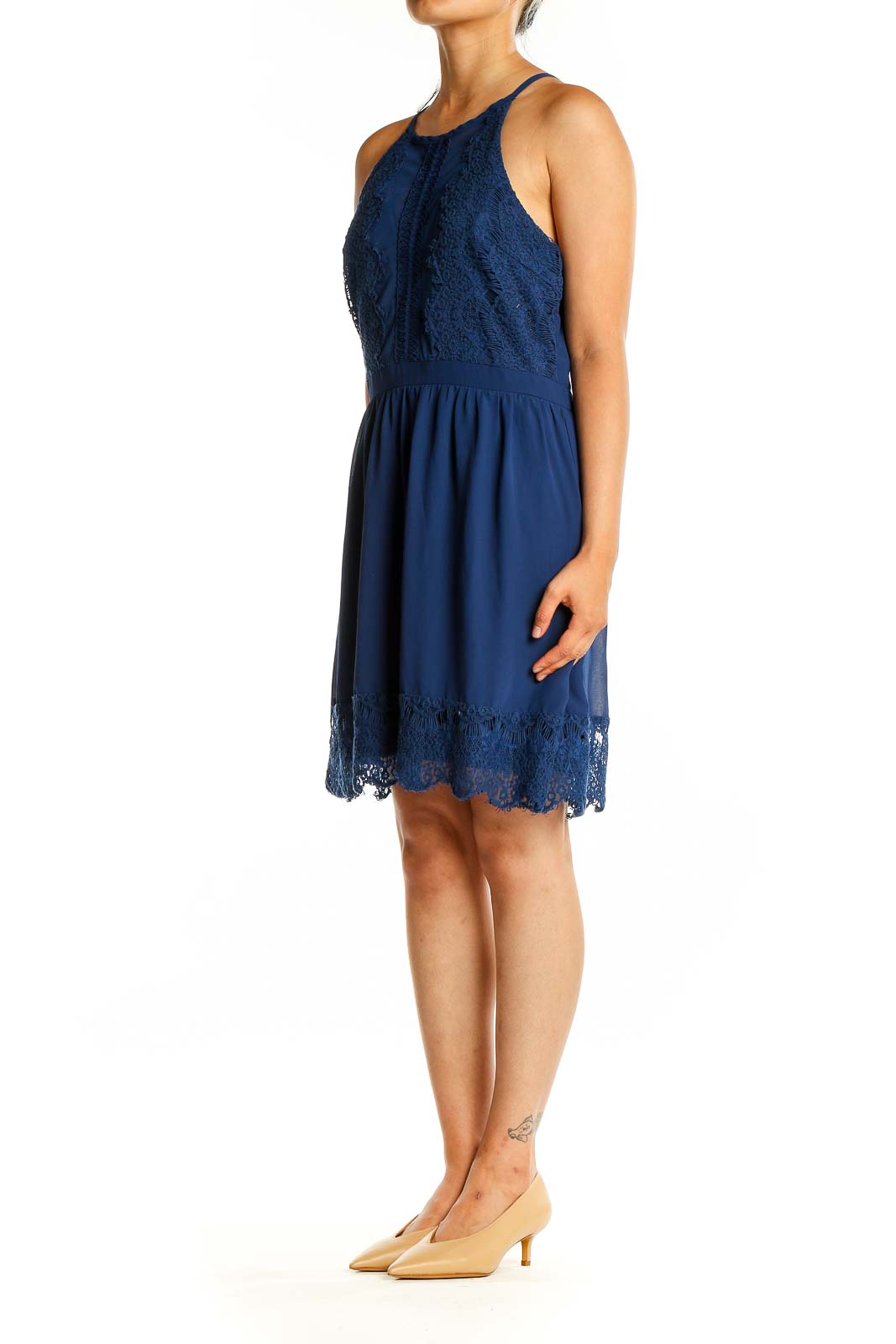 Front view of Francesca's navy lace trim halter dress with fitted bodice and flowy skirt