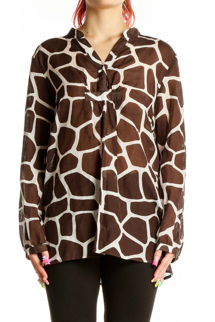 Front view of MICHAEL Michael Kors brown giraffe print blouse with V-neck and tie detail