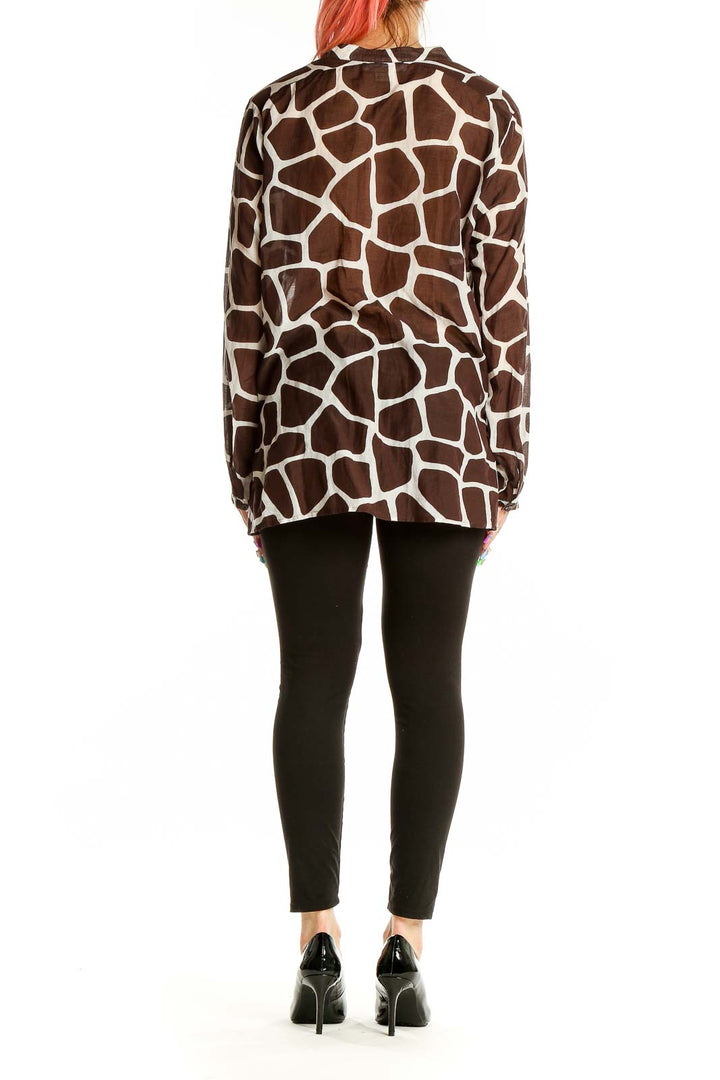 Back view of MICHAEL Michael Kors brown giraffe print blouse showing full length and pattern