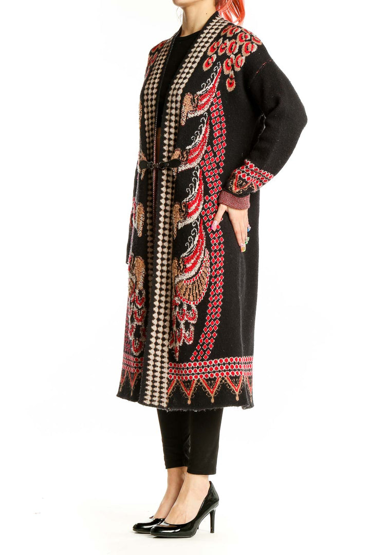 Front view of Vertigo black long cardigan with red and gold floral embroidery