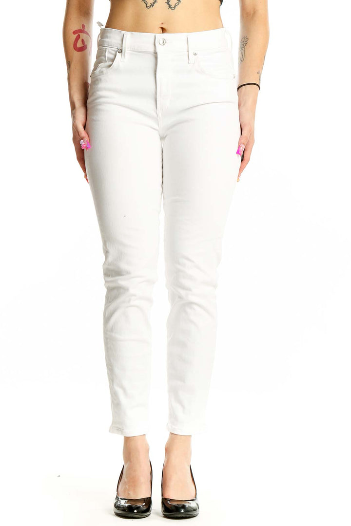 Front view of AGOLDE white slim fit jeans on model