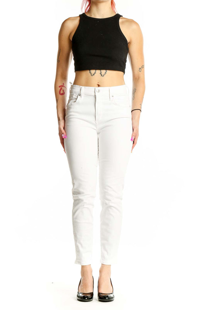 Front view of AGOLDE white slim fit jeans on model