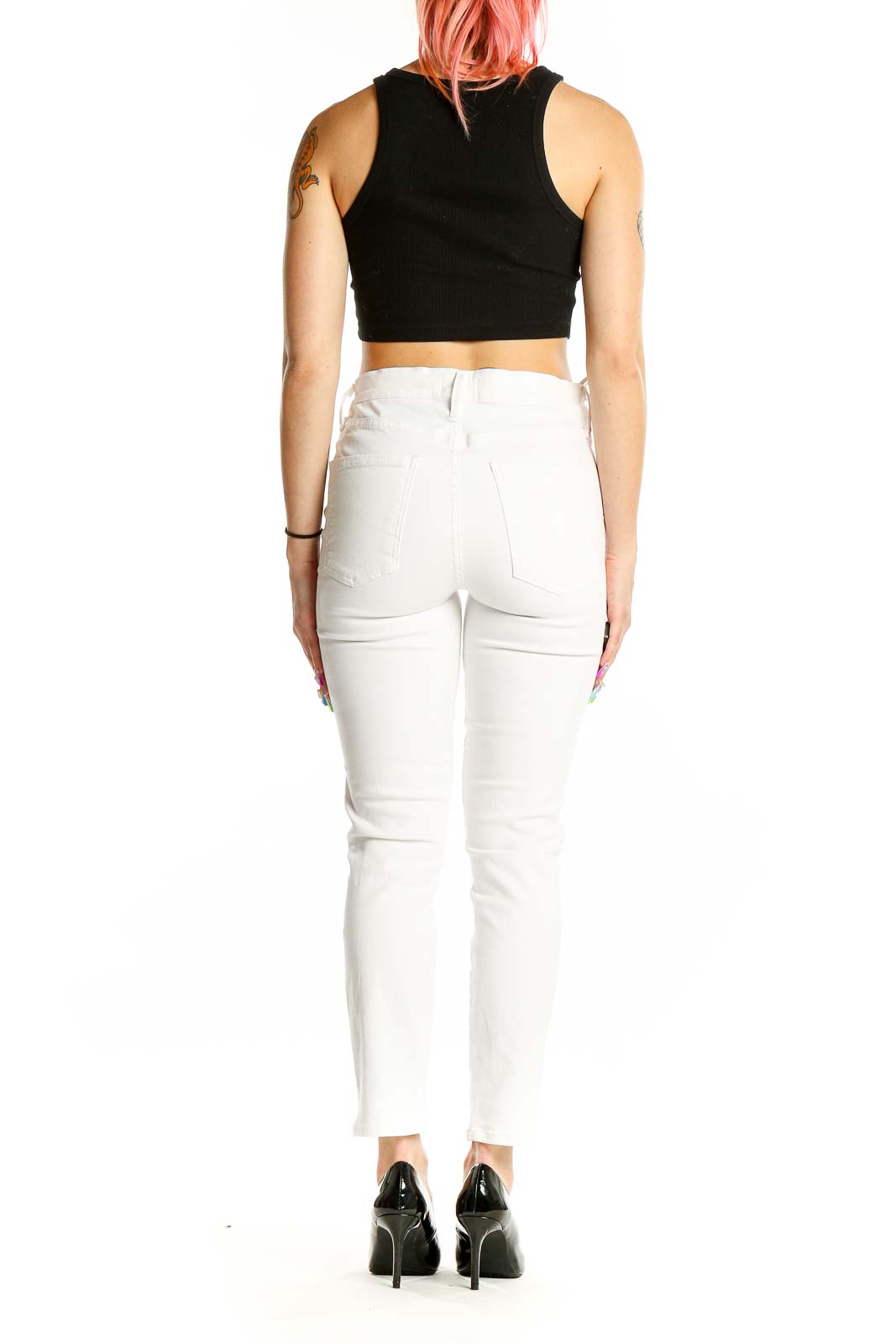 Back view of AGOLDE white slim fit jeans on model