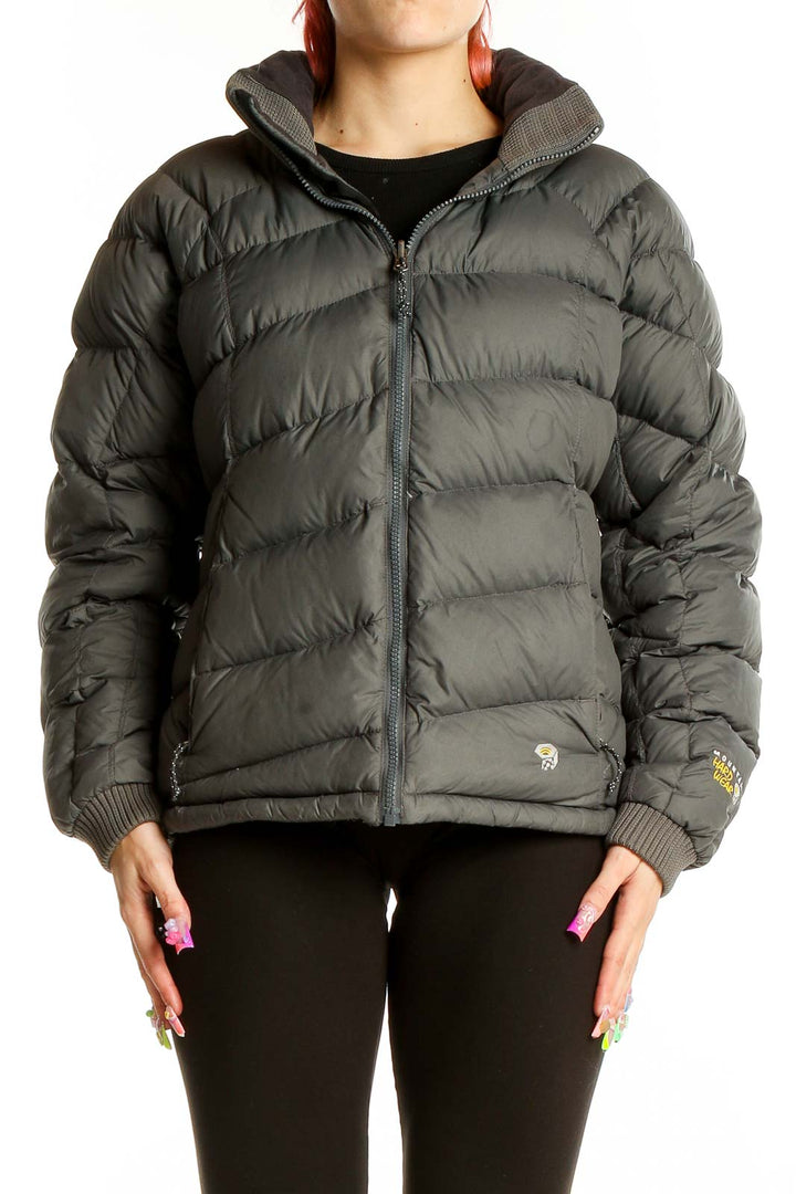 Front view of dark green Mountain Hard Wear puffer jacket with quilted design