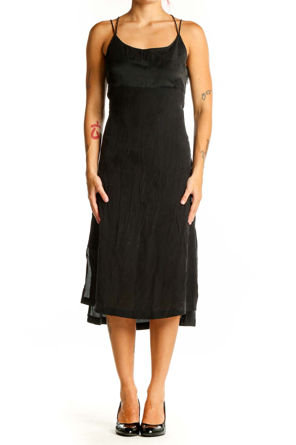 Front view of Madewell black midi slip dress with spaghetti straps