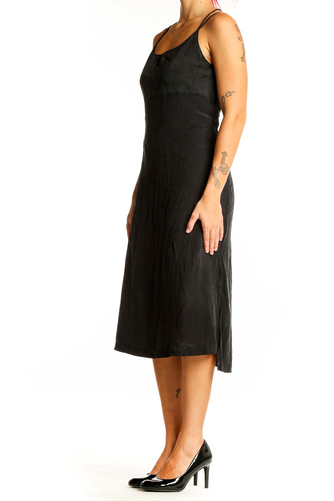 Front view of Madewell black midi slip dress with spaghetti straps