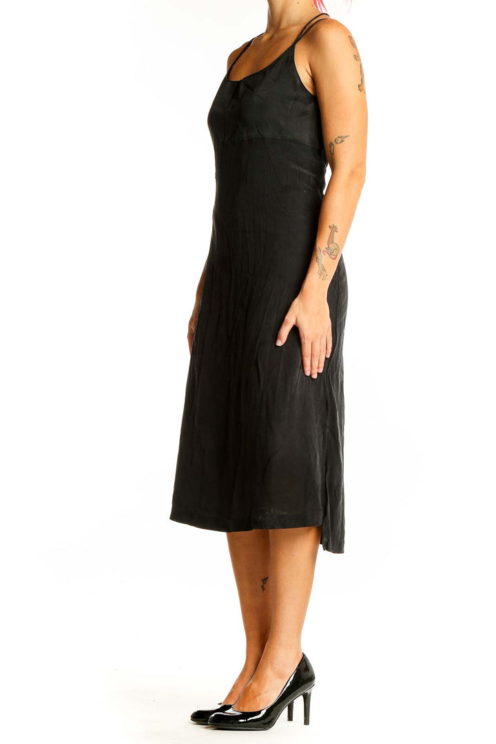 Front view of Madewell black midi slip dress with spaghetti straps