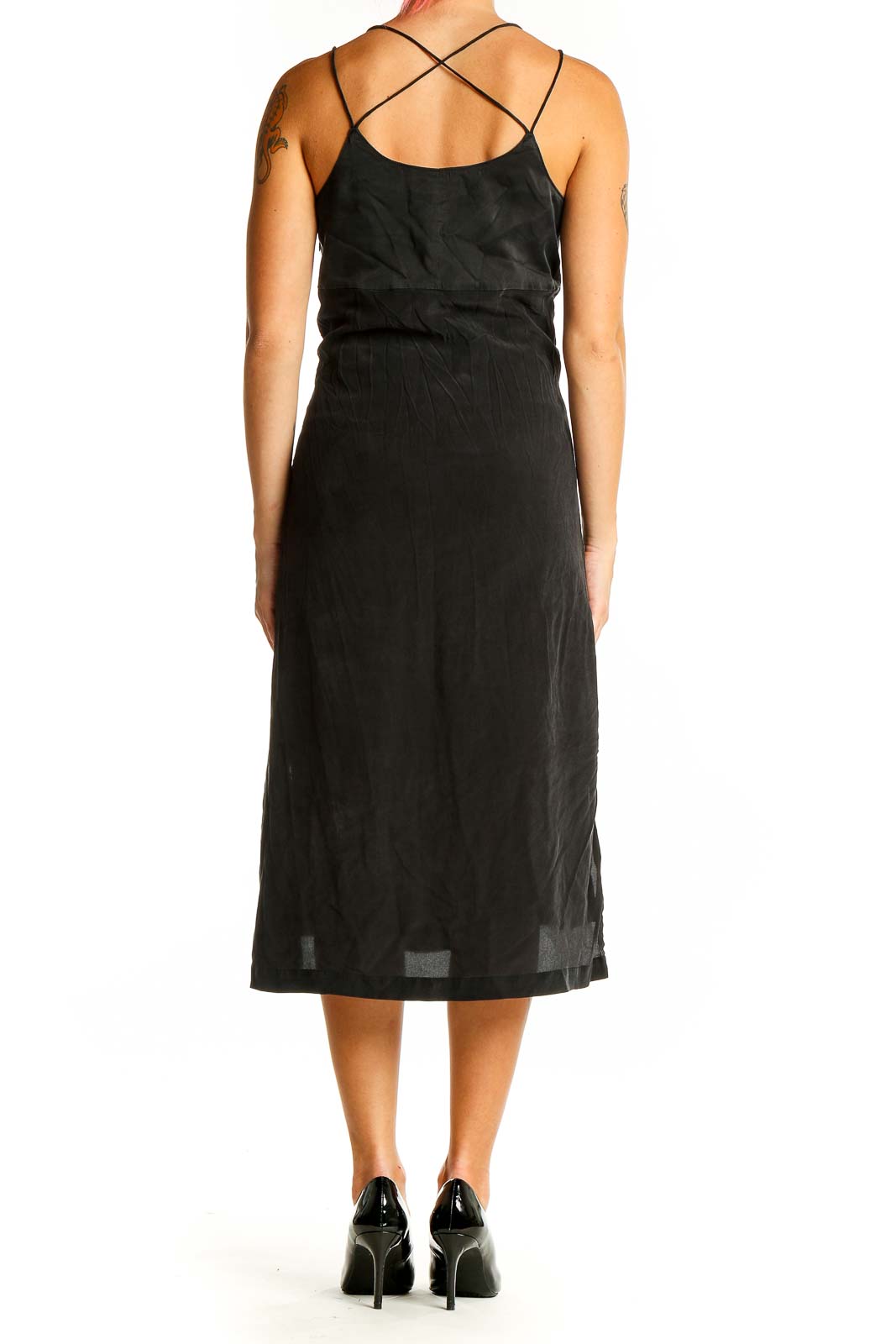 Back view of Madewell black midi slip dress showing cross-back straps