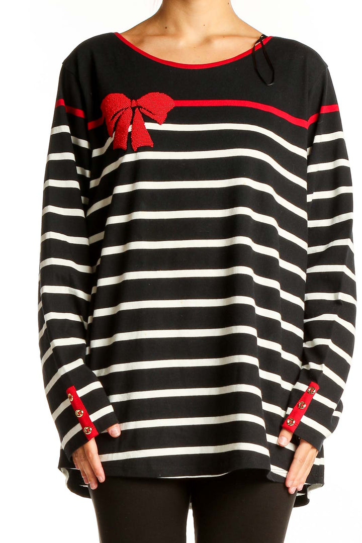 Front view of Charter Club black and white striped knit top with red bow accent