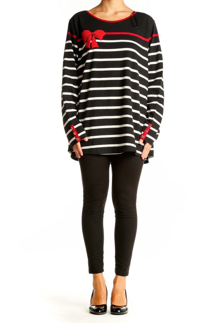 Front view of Charter Club black and white striped knit top with red bow accent