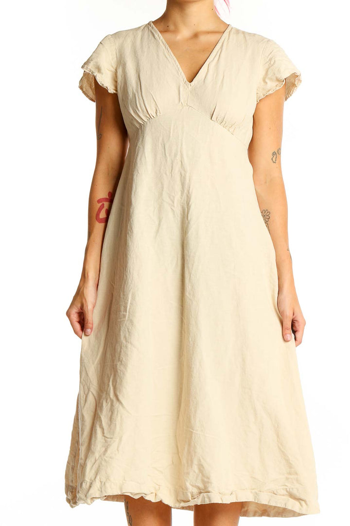 Front view of beige MNG midi dress with V-neck and frayed edges