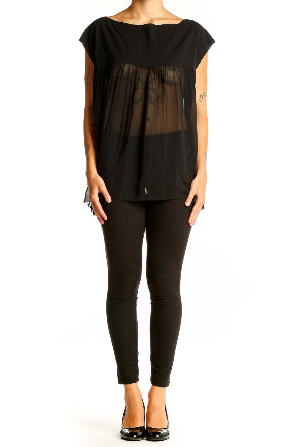 Front view of Vince black sleeveless top with sheer lower portion