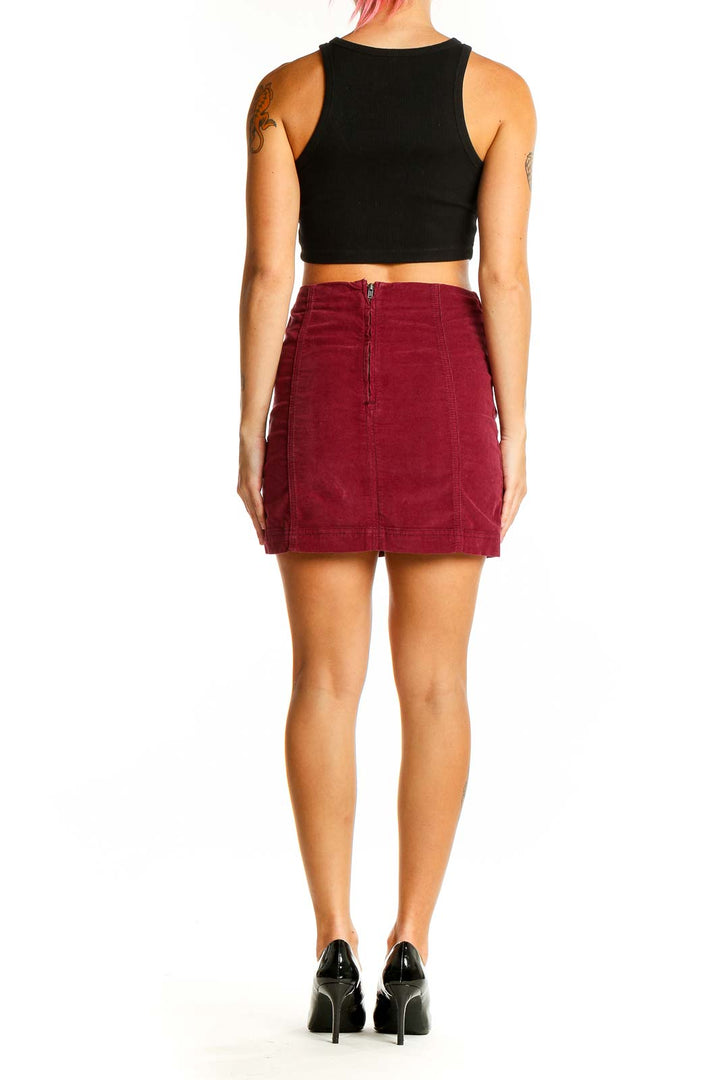 Back view of burgundy corduroy mini skirt with center zipper