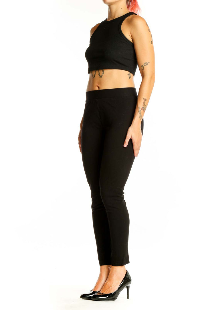 Front view of Vince Camuto black slim fit ankle-length pants