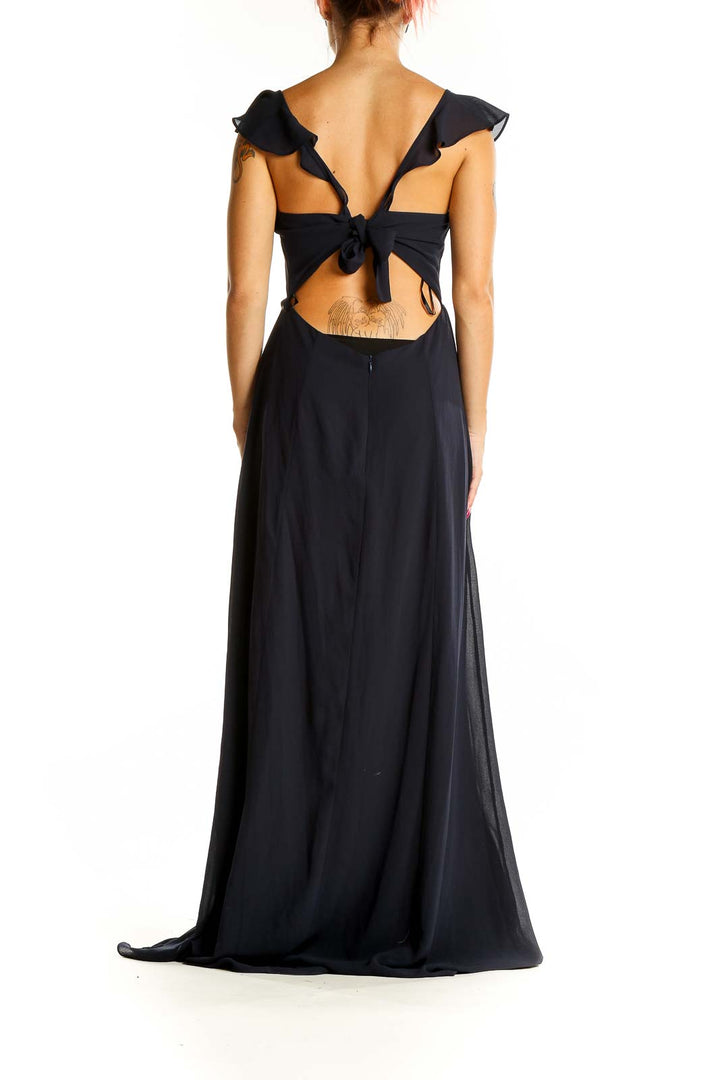 Back view of black BHLDN Anthropologie maxi dress showing tie detail and subtle cutout