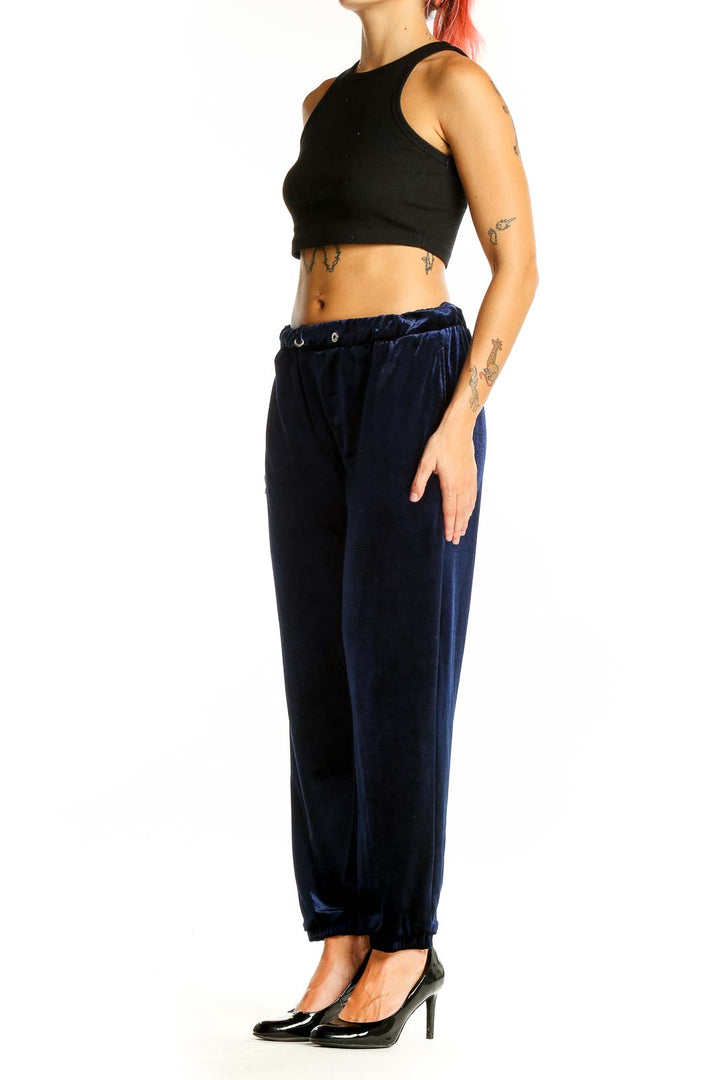 Front view of Zara Trafaluc navy velvet jogger pants with elastic waistband