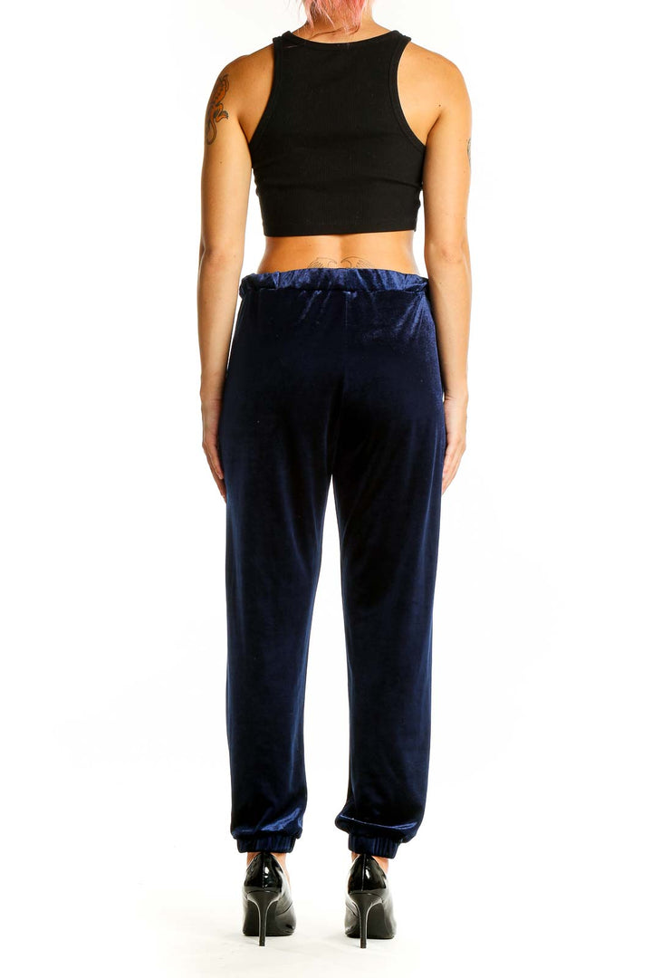 Back view of Zara Trafaluc navy velvet jogger pants showing tapered legs and cuffs