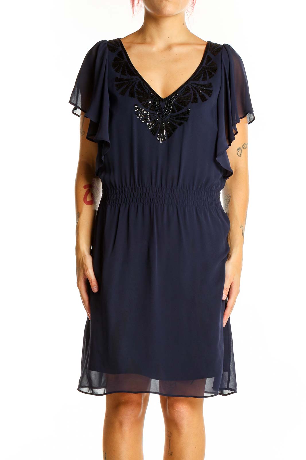 Front view of navy chiffon cocktail dress with flutter sleeves and sequin embellished V-neckline