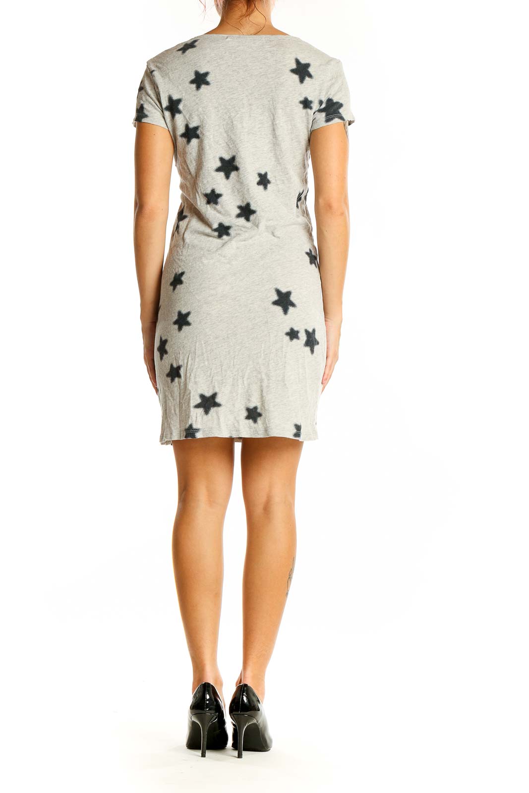 Back view of PAM & GELA gray cotton t-shirt dress showing allover star print