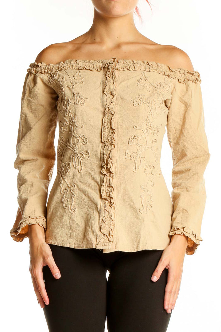 Front view of Rancho Estancia beige off-shoulder embroidered cotton jacket