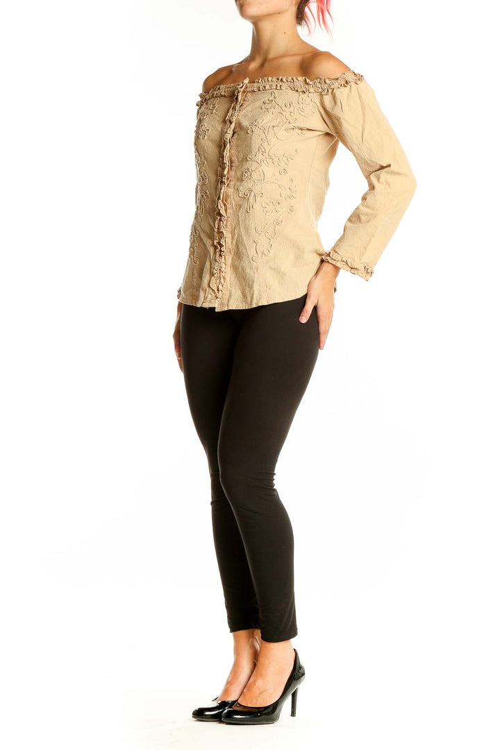 Front view of Rancho Estancia beige off-shoulder embroidered cotton jacket