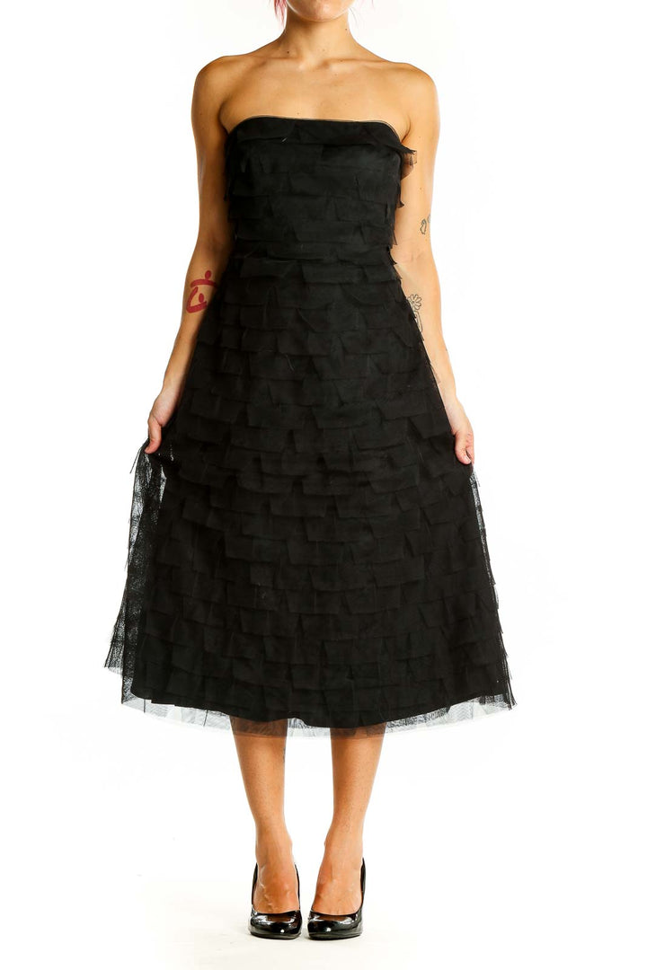 Front view of black strapless BCBG MaxAzria midi dress with tiered tulle skirt