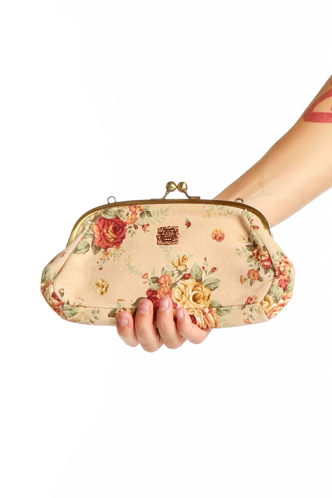 Anna Sui beige floral clutch with gold-toned clasp, front view