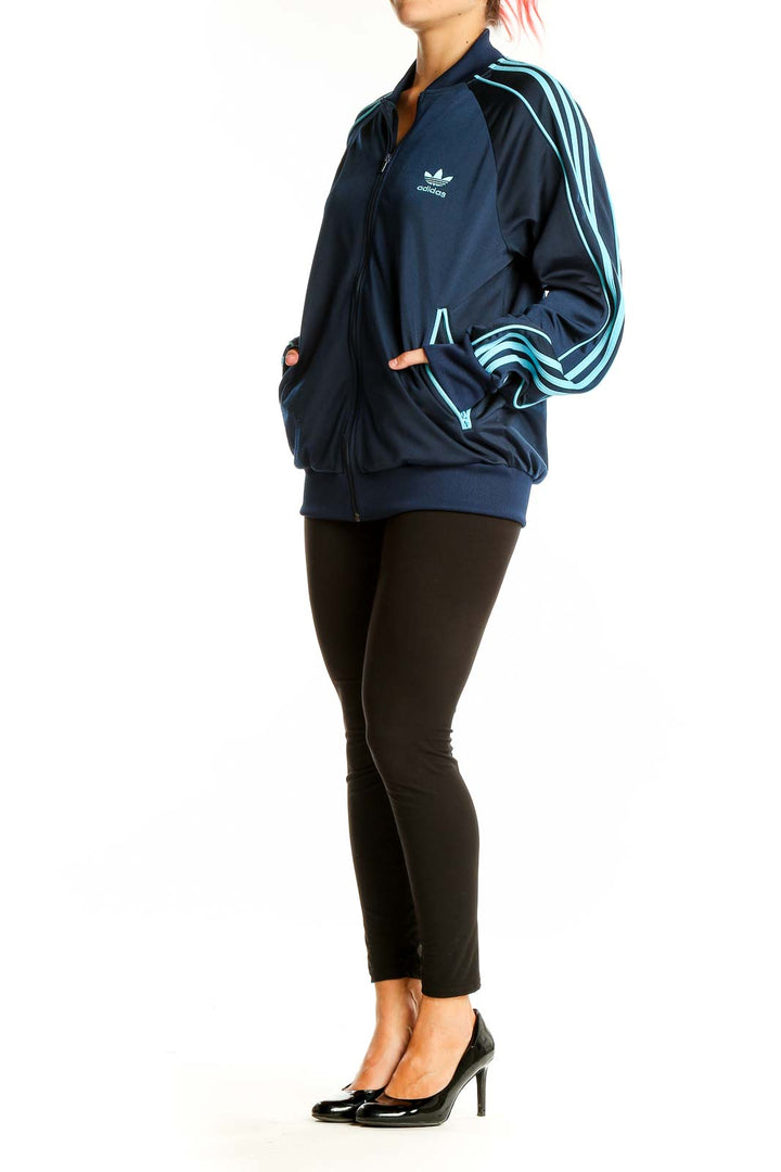 Front view of Adidas navy blue track jacket with light blue stripes