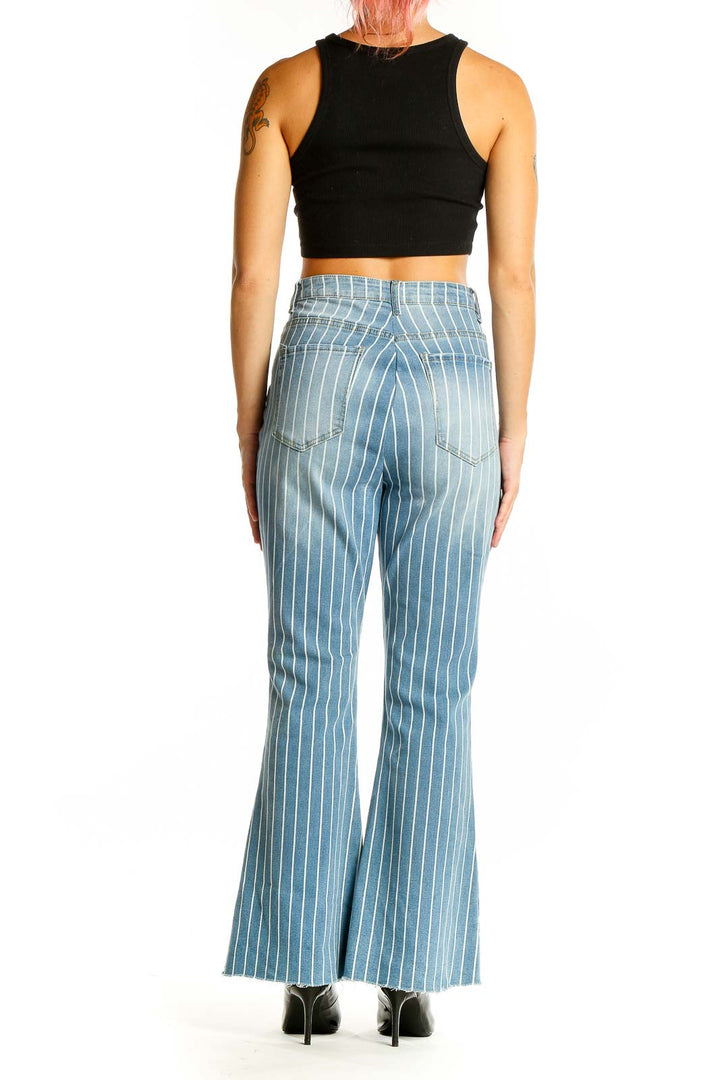 Back view of SilkRoll light blue striped flare jeans on model