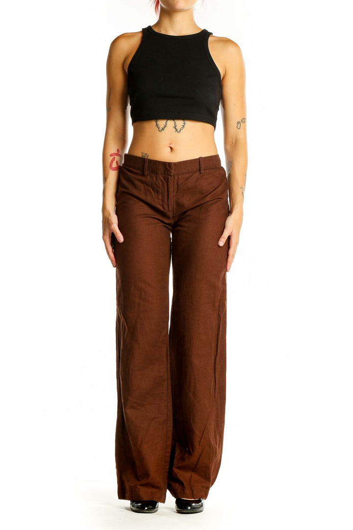 Front view of BCBG MaxAzria brown wide-leg trousers on model