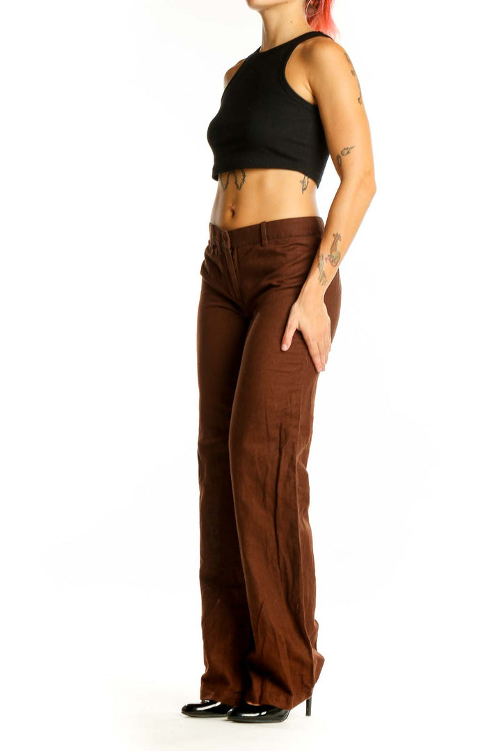 Front view of BCBG MaxAzria brown wide-leg trousers on model