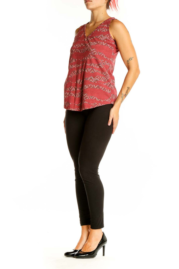 Front view of Sherpa Adventure Gear red geometric print V-neck tank top