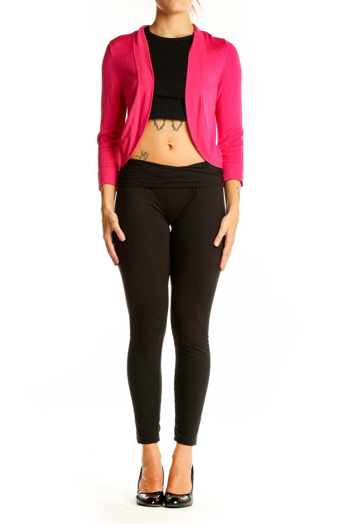 Front view of hot pink cropped cardigan sweater with open front design