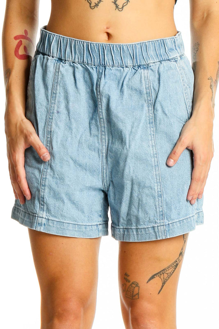 Front view of Madewell light blue denim shorts with elastic waistband