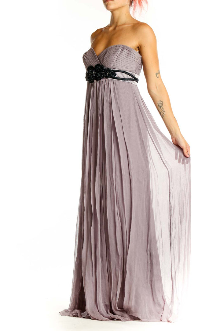 Front view of lavender strapless BCBG MaxAzria gown with black beaded waistline