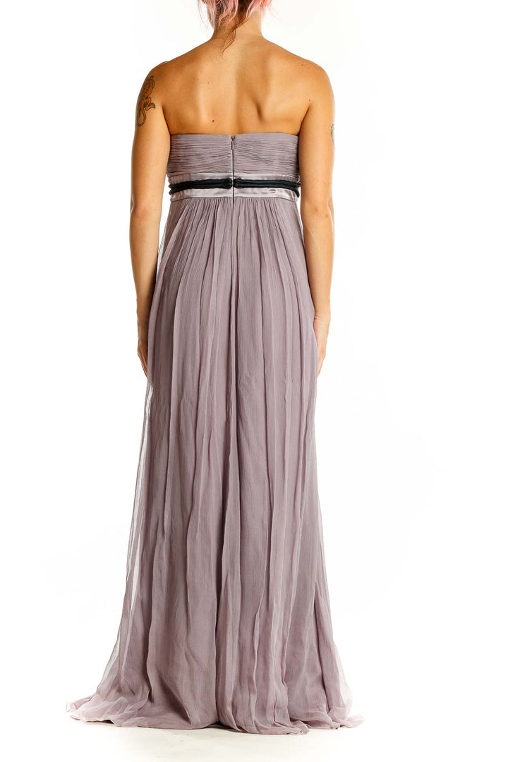 Back view of lavender BCBG MaxAzria gown showing strapless design and zipper closure